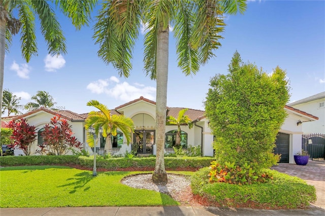 mediterranean / spanish-style house featuring a garage