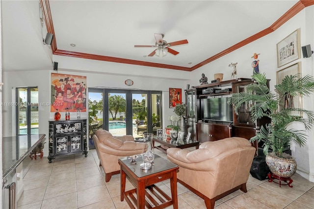 tiled living room featuring ceiling fan, ornamental molding, and french doors