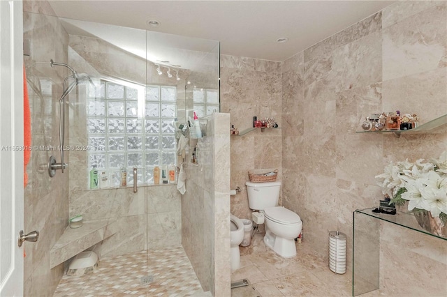 bathroom with tile patterned flooring, a bidet, a shower with shower door, tile walls, and toilet