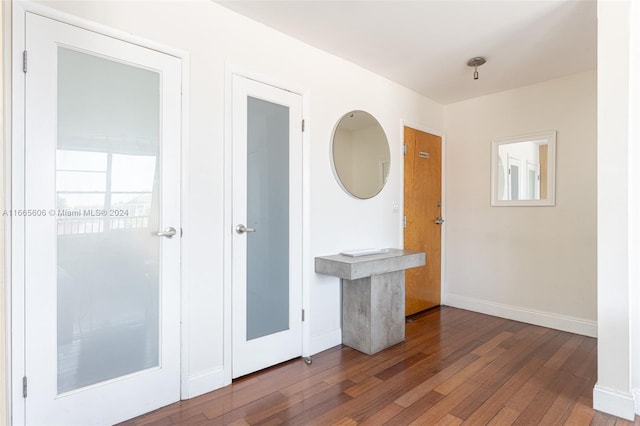 corridor with hardwood / wood-style floors