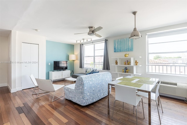 living room with ceiling fan and hardwood / wood-style flooring