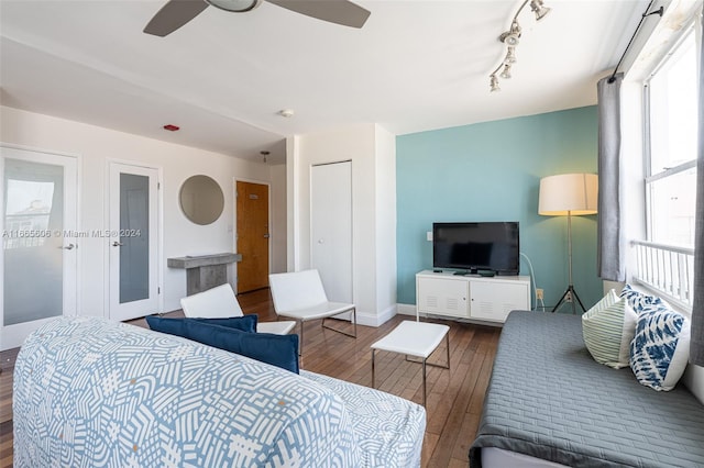 420 15th St Unit 307, Miami Beach, FL 33139 - bedroom with wood-type flooring, multiple windows, ceiling fan, and baseboards