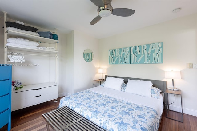 bedroom with ceiling fan and dark hardwood / wood-style floors