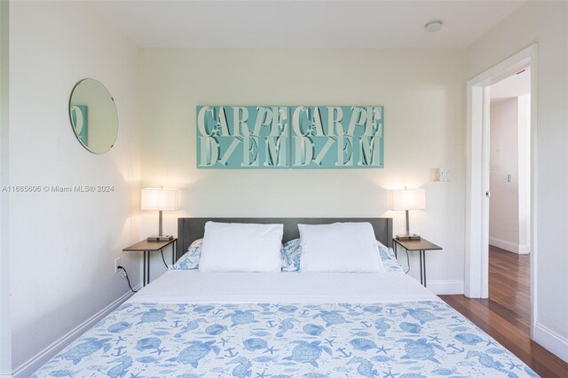 bedroom featuring dark wood-type flooring