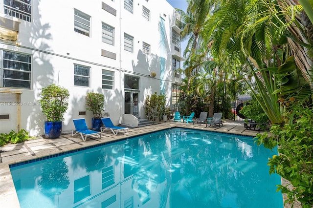 view of swimming pool featuring a patio area