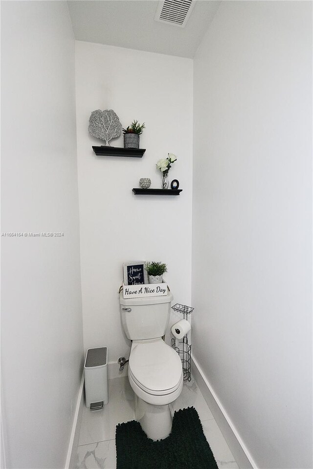 bathroom featuring toilet