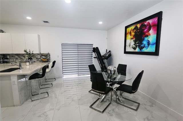 dining space featuring sink