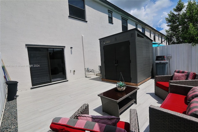 exterior space featuring an outdoor hangout area, a grill, and a deck