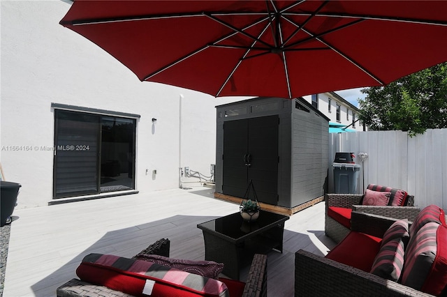 view of patio featuring a deck and an outdoor hangout area