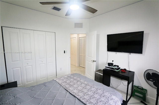 bedroom with ceiling fan and a closet