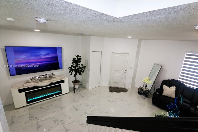 living room with a textured ceiling