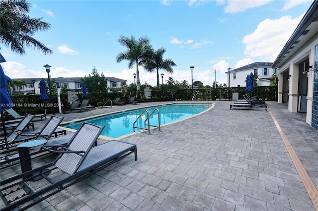 view of pool featuring a patio