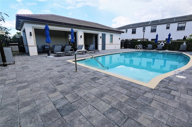 view of pool with a patio