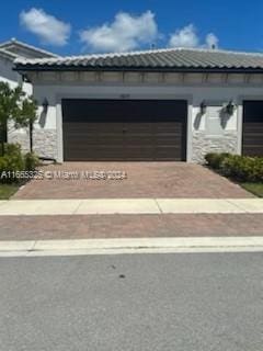 view of front of property featuring a garage