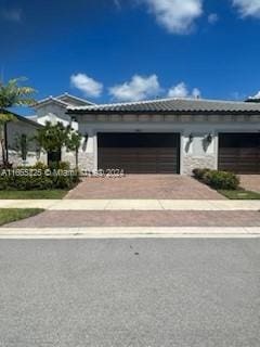 view of front of property featuring a garage