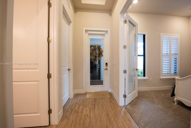 corridor featuring light wood-type flooring