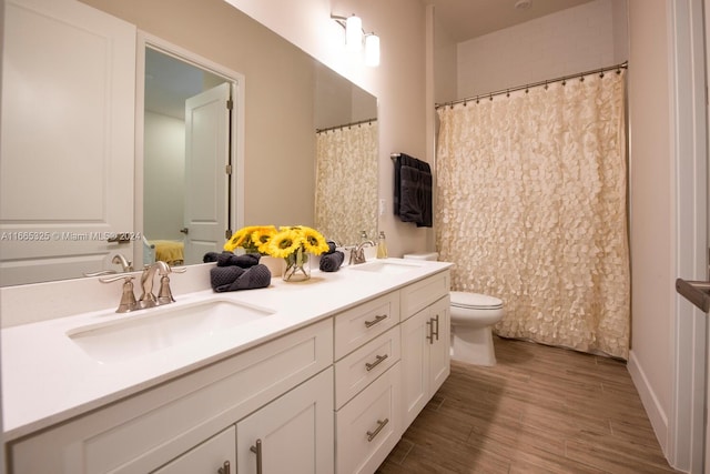 bathroom with vanity, hardwood / wood-style floors, toilet, and a shower with shower curtain