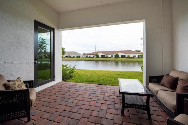 view of patio / terrace with a water view