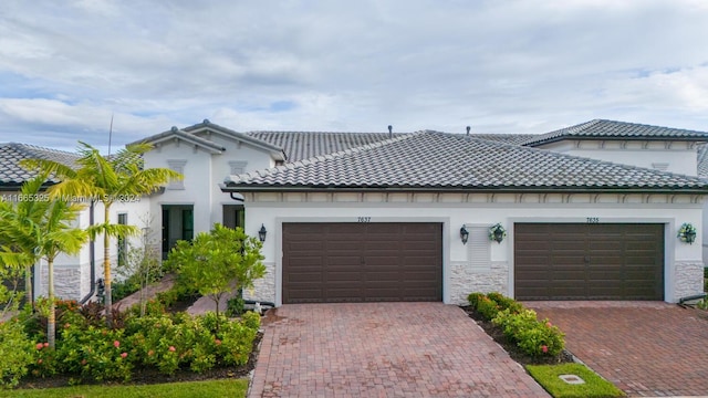 mediterranean / spanish-style home with a garage