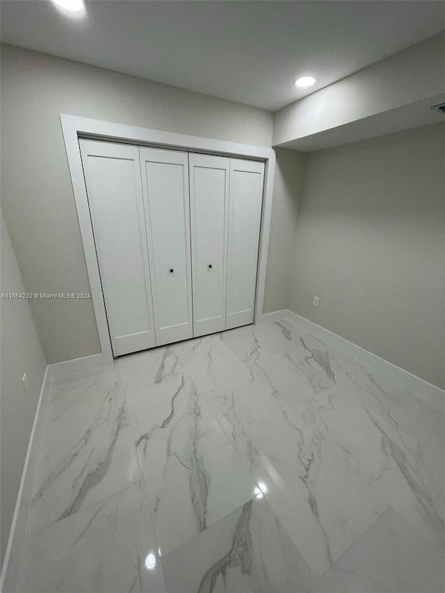 unfurnished bedroom with a closet