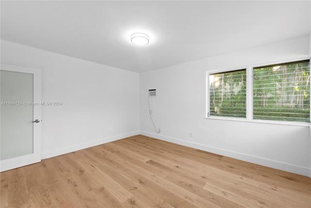 unfurnished room featuring light hardwood / wood-style flooring