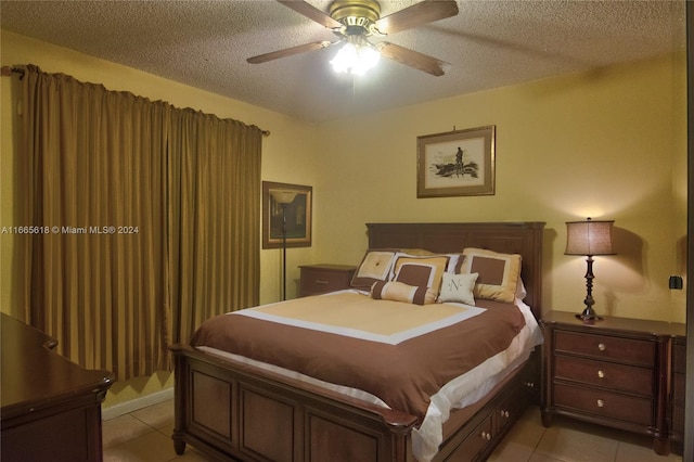 bedroom with ceiling fan, a textured ceiling, and light tile patterned floors