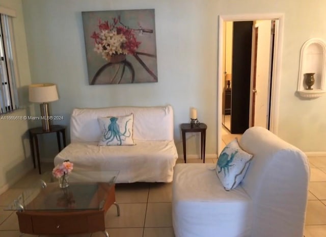 living room featuring light tile patterned flooring