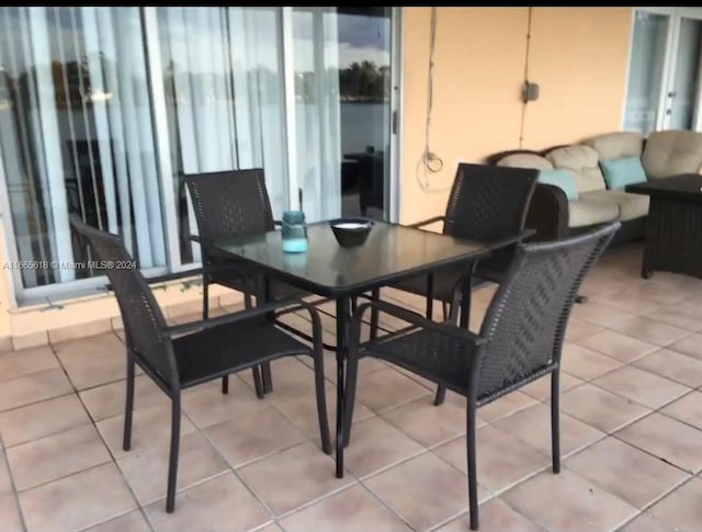 dining space with light tile patterned floors