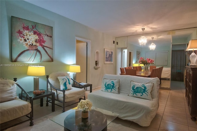 tiled living room with an inviting chandelier