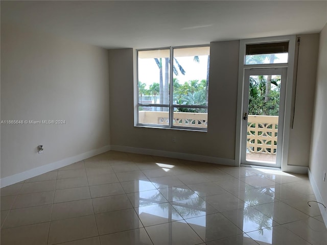 empty room with light tile patterned floors