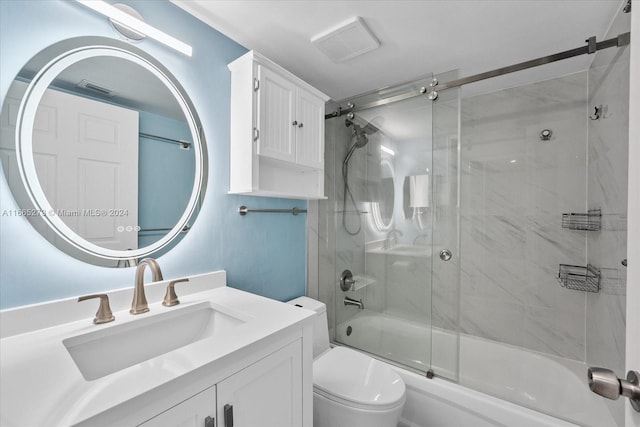 full bathroom featuring combined bath / shower with glass door, vanity, and toilet