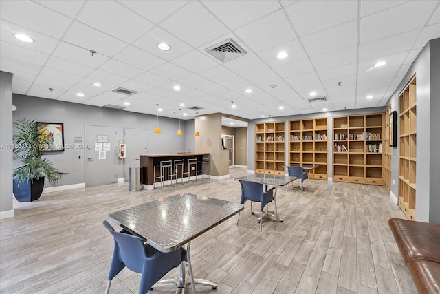 interior space with light hardwood / wood-style flooring and a paneled ceiling