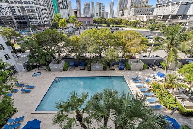 view of swimming pool featuring a patio area