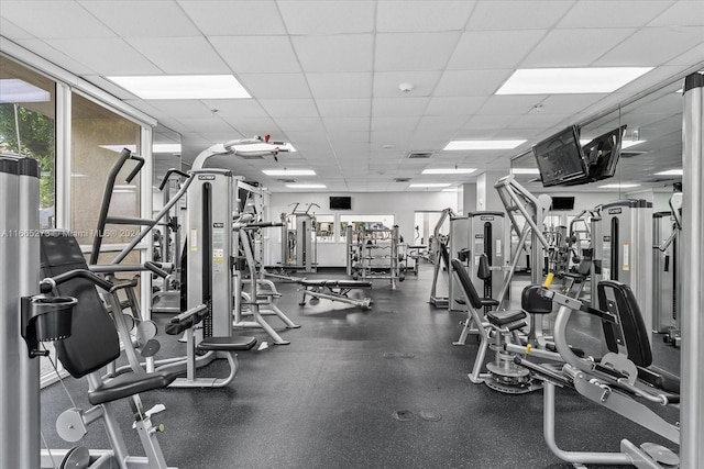 gym featuring a paneled ceiling