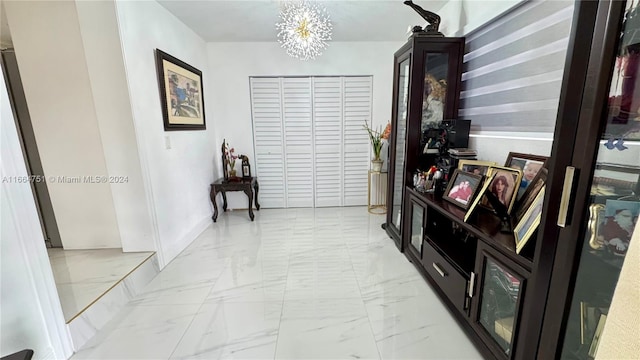 hallway featuring an inviting chandelier