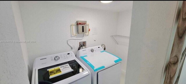 laundry room with washer and clothes dryer