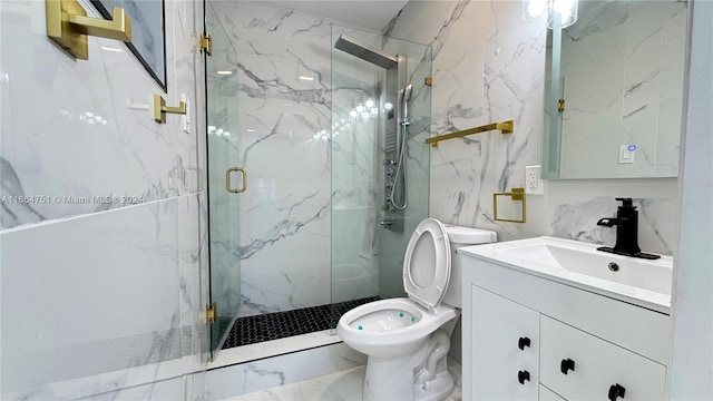 bathroom featuring vanity, toilet, and a shower with shower door