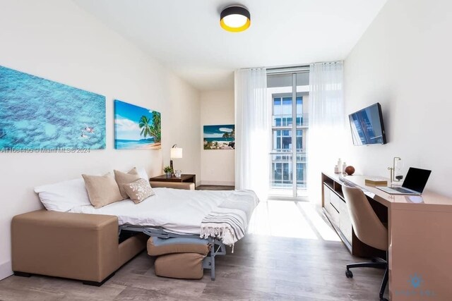777 N Ocean Dr Unit N319, Hollywood, FL 33019 - bedroom featuring wood finished floors and expansive windows