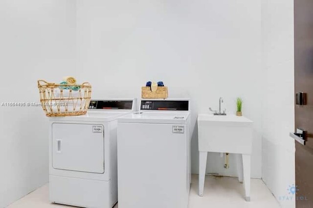 clothes washing area featuring washer and clothes dryer