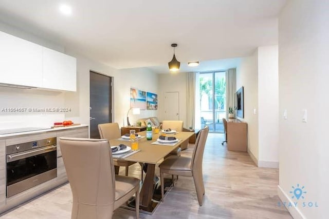 dining room with light hardwood / wood-style flooring