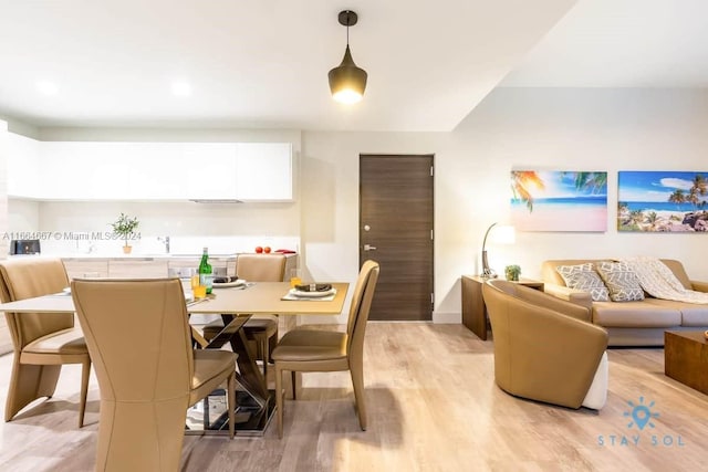 dining area with light wood finished floors