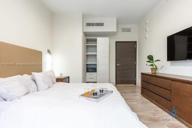 bedroom with light wood-type flooring