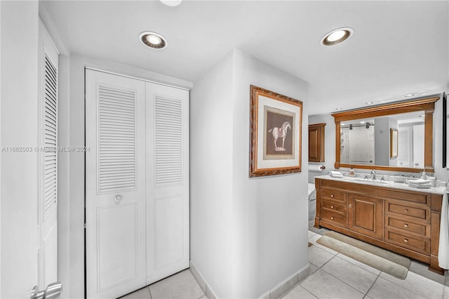 bathroom featuring vanity and tile patterned flooring