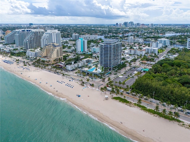 bird's eye view with a water view and a view of the beach