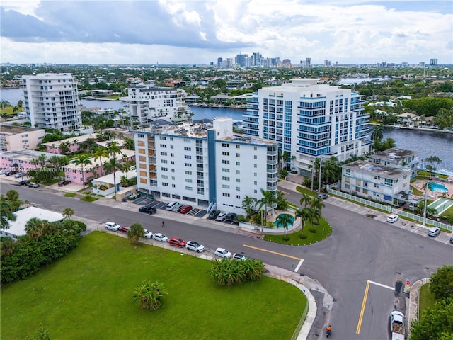 birds eye view of property with a water view