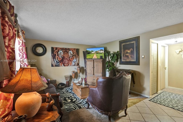 tiled living room with a textured ceiling