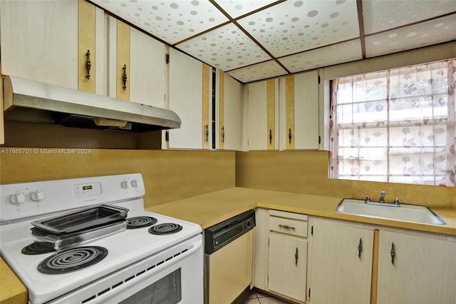 kitchen with sink and white appliances