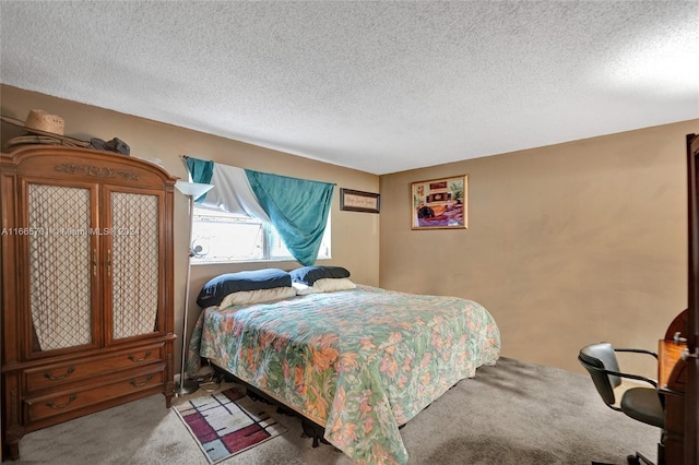 carpeted bedroom with a textured ceiling