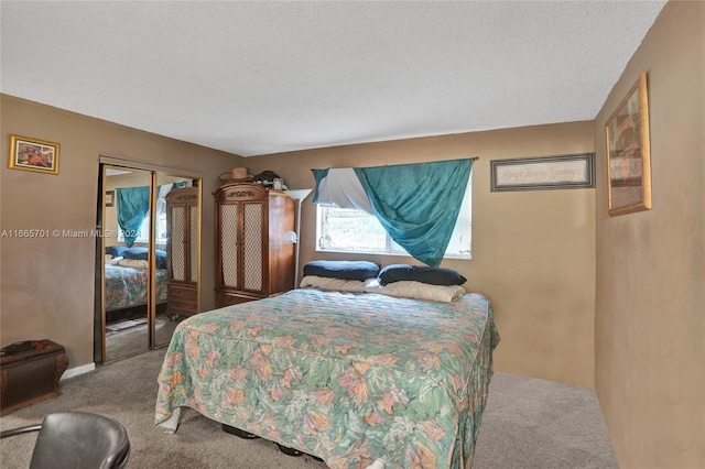 bedroom featuring light carpet, a closet, and a textured ceiling