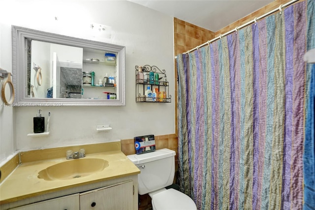 bathroom featuring vanity, toilet, and a shower with shower curtain